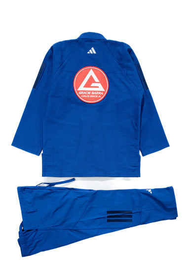Back view of blue Gracie Barra Axis Kimono by adidas with large Red Shield on the back and adidas logo below the collar, displayed on a white background.