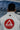 Back view of a Gracie Barra student wearing the white AXIS Kimono by adidas showing the large red Gracie Barra shield and adidas logo below the collar.