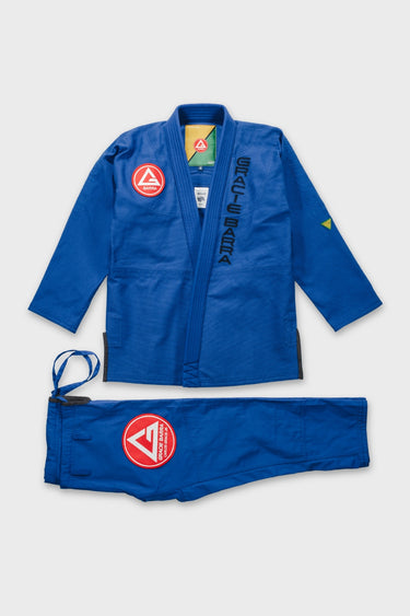 Blue Continuum Kimono by VG Jiu-Jitsu gi laid flat, jacket front with red Barra chest patch and GRACIE BARRA lapel embroidery, plus gi pants.