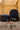 Gracie Barra Jiu-Jitsu black backpack and matching insulated lunchbox side by side outside a school