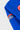 Close-up of the kimono sleeve with woven Gracie Barra Jiu-Jitsu label and red round patch on blue ripstop fabric