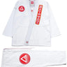 40 Year Anniversary white BJJ kimono flat lay showing jacket and pants with Barra Shield, Gracie Barra Patch, and Legacy G detail