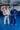 Two Gracie Barra professors wearing the adidas Axis Kimono in blue and white standing on the training mats inside a Gracie Barra school
