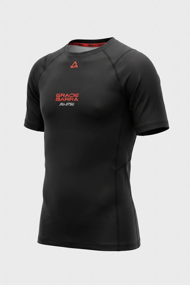 Kids black Gracie Barra Close Contact rashguard front view with red chest logo and raglan sleeves