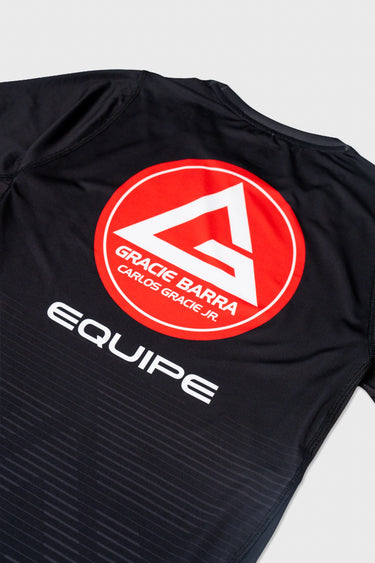 Red Gracie Barra Equipe logo printed across the upper back of the black Close Contact rashguard