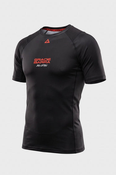 Black Gracie Barra Close Contact rashguard front view with red chest logo and raglan sleeve seams