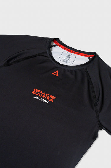 Red Gracie Barra Jiu-Jitsu chest logo and branded neck tape on the womens Close Contact rashguard