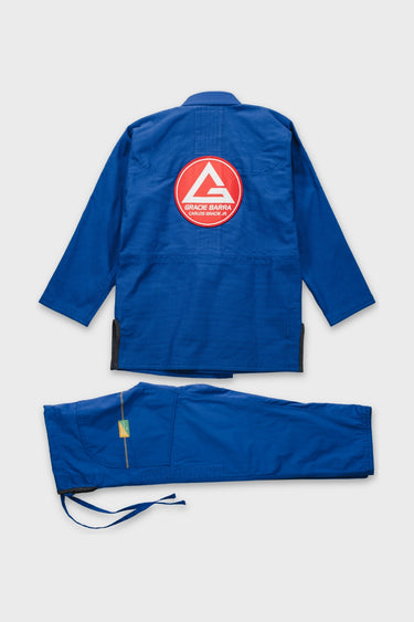 Back of the blue Continuum Kimono by VG gi, jacket with red Gracie Barra Carlos Gracie Jr. patch and pants with tonal VANGUARD leg embroidery.