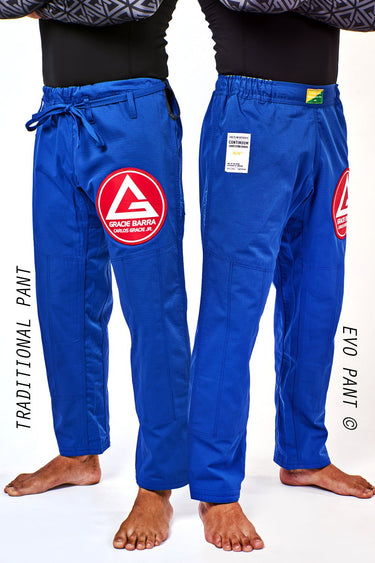 Traditional Pant and Evo Pant of the blue Gracie Barra Continuum Kimono side by side, showing the drawstring and elastic waistbands with red thigh patches.