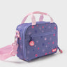 Purple Sakura Kids Lunchbox with pink floral pattern, three-quarter view showing the front zippered pocket, Gracie Barra logo patch, and pink adjustable shoulder strap.