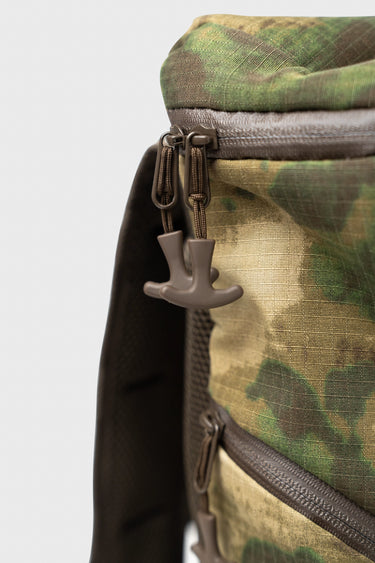 Close-up of the Tactical GB4 Backpack top zippers with dual paracord pulls in camo.